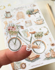 Premium Handmade Sticker Sheet
Aesthetic Cozy 105mm x 148mm - a piece on the finger and a sheet on the table with a pencil, an opened notebook