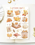 Premium Handmade Sticker Sheet Autumn in my Heart 105mm x 148mm - a sheet on the table with a white flower branch, an opened notebook