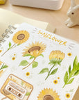 Premium Handmade Sticker Sheet Chamomile Sunflower 105mm x 148mm - a sheet on the table with a rabbit statue