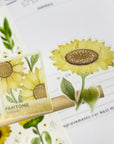 Premium Handmade Sticker Sheet Chamomile Sunflower 105mm x 148mm - 2 pieces on the stick and a sheet on the table