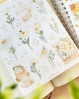Premium Handmade Sticker Sheet Chamomile Sunflower 105mm x 148mm - a sheet on the table with an opened notebook