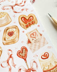 Premium Handmade Sticker Sheet
Chocolate Lover 105mm x 148mm - a sheet on the table with a dark maroon flower branch, a pencil
