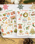 Premium Handmade Sticker Sheet Christmas 105mm x 148mm - 2 sheets on the table with an opened notebook, an acorn, 5 pinecones, 3 stars