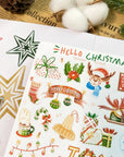 Premium Handmade Sticker Sheet Christmas 105mm x 148mm - a sheet on the table with an opened notebook, a pinecone, 3 stars