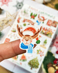 Premium Handmade Sticker Sheet Christmas 105mm x 148mm - a piece and a sheet on the table with an opened notebook, an acorn, 5 stars