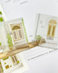 Premium Handmade Sticker Sheet Cozy Doors 105mm x 148mm - 2 pieces on the stick and a sheet on the table