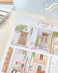 Premium Handmade Sticker Sheet Cozy Doors 105mm x 148mm - a sheet on the table