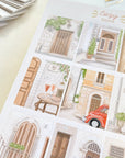 Premium Handmade Sticker Sheet Cozy Doors 105mm x 148mm - a sheet on the table