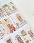 Premium Handmade Sticker Sheet Cozy Doors 105mm x 148mm - a sheet on the table