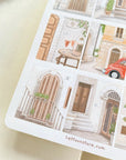 Premium Handmade Sticker Sheet Cozy Doors 105mm x 148mm - a sheet on the table