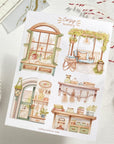 Premium Handmade Sticker Sheet Cozy Scenery 105mm x 148mm - 4 pieces on the table with dark maroon flower branch