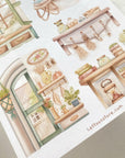 Premium Handmade Sticker Sheet Cozy Scenery 105mm x 148mm - 4 pieces on the table