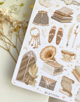 Premium Handmade Sticker Sheet Dark & Light Academia 105mm x 148mm - a sheet on the table with an opened notebook, a white flower branch