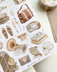 Premium Handmade Sticker Sheet Dark & Light Academia 105mm x 148mm - a washi tape and a sheet on the table with an opened notebook