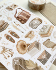 Premium Handmade Sticker Sheet Dark & Light Academia 105mm x 148mm - a washi tape and a sheet on the table with an opened notebook