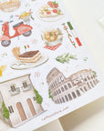 Premium Handmade Sticker Sheet In Love With Italy 105mm x 148mm - a sheet on the table with an opened notebook