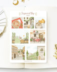 Premium Handmade Sticker Sheet Inspired by Italy 105mm x 148mm - a sheet on the table with a white flower branch, an opened notebook