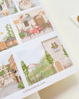 Premium Handmade Sticker Sheet Inspired by Italy 105mm x 148mm - a sheet on the table with an opened notebook
