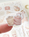 Premium Handmade Sticker Sheet Knitting Crochet 105mm x 148mm - a piece on the finger and a sheet on the table