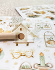 Premium Handmade Sticker Sheet Magical Cozy Fall 105mm x 148mm - a piece and 2 sheets on the table