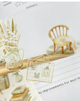 Premium Handmade Sticker Sheet Magical Cozy Fall 105mm x 148mm - 3 pieces and a sheet on the table with an opened notebook