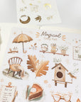 Premium Handmade Sticker Sheet Magical Cozy Fall 105mm x 148mm - a sheet on the table with an opened notebook