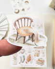 Premium Handmade Sticker Sheet Magical Cozy Fall 105mm x 148mm - a piece and a sheet on the table with a pencil