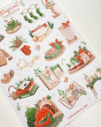 Premium Handmade Sticker Sheet Magical Cozy Winter 105mm x 148mm - a sheet on the table
