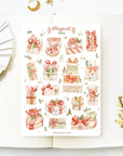Premium Handmade Sticker Sheet Present Time 105mm x 148mm - a sheet on the table with a white flower branch, an opened notebook