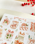 Premium Handmade Sticker Sheet Present Time 105mm x 148mm - a sheet on the table with a red berry branch, an opened notebook