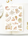 Premium Handmade Sticker Sheet Reading at Home 105mm x 148mm - a sheet on the table with a white flower branch, an opened notebook
