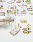 Premium Handmade Sticker Sheet Reading at Home 105mm x 148mm - a piece on the stick and 3 pieces and 2 sheets on the table with a dark maroon flower branch, an opened notebook, a pencil, a ruler