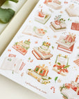 Premium Handmade Sticker Sheet
Reading in the Winter 105mm x 148mm - a sheet on the table with a branch