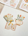 Premium Handmade Sticker Sheet Reading Time 105mm x 148mm - 3 pieces and 2 sheets on the table with an opened notebook