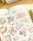 Premium Handmade Sticker Sheet Reading Time 105mm x 148mm - a sheet on the table with the opened notebook