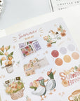 Premium Handmade Sticker Sheet Summer Breeze 105mm x 148mm - a sheet on the table with an opened notebook