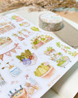 Premium Handmade Sticker Sheet
Veggie Garden 105mm x 148mm - a sheet on the table with a white flower branch, an opened notebook, a washi tape