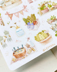 Premium Handmade Sticker Sheet
Veggie Garden 105mm x 148mm - a sheet on the table with an opened notebook