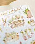 Premium Handmade Sticker Sheet
Veggie Garden 105mm x 148mm - a sheet on the table with an opened notebook