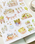 Premium Handmade Sticker Sheet
Veggie Garden 105mm x 148mm - a sheet on the table with a washi tape, an opened notebook