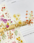 Premium Handmade Sticker Sheet Wild Flower 105mm x 148mm - 3 pieces on the stick and a sheet on the table
