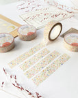 Premium Handmade Washi Tape Blooming Flower 15mm x 10m - 4 pieces and 4 washi tapes on the table with 2 dark maroon branches, a sticker sheet, a chapter heading