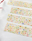 Premium Handmade Washi Tape Blooming Flower 15mm x 10m - 4 pieces on the table with a dark maroon branch