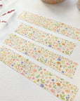 Premium Handmade Washi Tape Blooming Flower 15mm x 10m - 4 pieces and 2 washi tapes on the table with a dark maroon branch