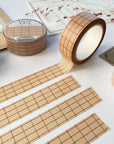Premium Handmade Washi Tape Brown Grid 15mm x 10m - 4 pieces and 4 washi tapes on the table with a dark maroon flower branch, a chapter heading, a sticker sheet