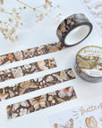 Premium Handmade Washi Tape Butterfly 15mm x 10m - 4 pieces and 2 washi tapes and 2 sticker sheets on the table with a white flower branch