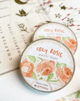 Premium Handmade Washi Tape Cozy Rosie 15mm x 10m - 2 washi tapes on the table with a pink flower branch and chapter sheet