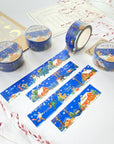 Premium Handmade Washi Tape Cozy Winter 20mm x 10m - 4 pieces and 4 washi tapes on the table with 2 dark maroon flower branches, a sticker sheet, a chapter heading, a notebook