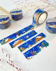 Premium Handmade Washi Tape Cozy Winter 20mm x 10m - 4 pieces and 4 washi tapes on the table with 2 dark maroon flower branches, a sticker sheet, a chapter heading, a notebook