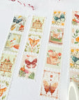Premium Handmade Washi Tape Dreamy Stamp 25mm x 5m - 4 pieces and 1 washi tapes on the table with a pink flower branch, a notebook
